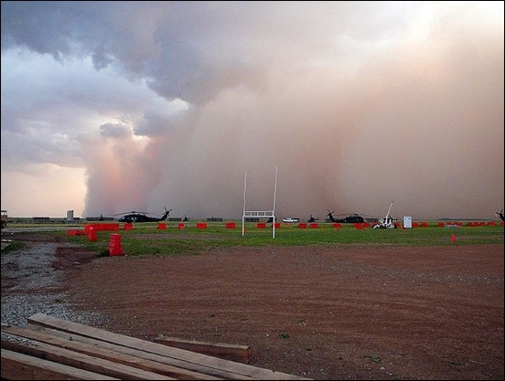 dust-about-to-envelope-the-helicopters-